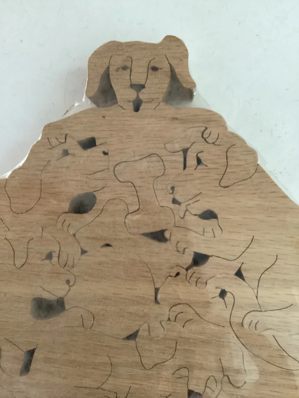 Hans Wooden Dog Shapes puzzle  9 pieces of dogs, bones and a ball